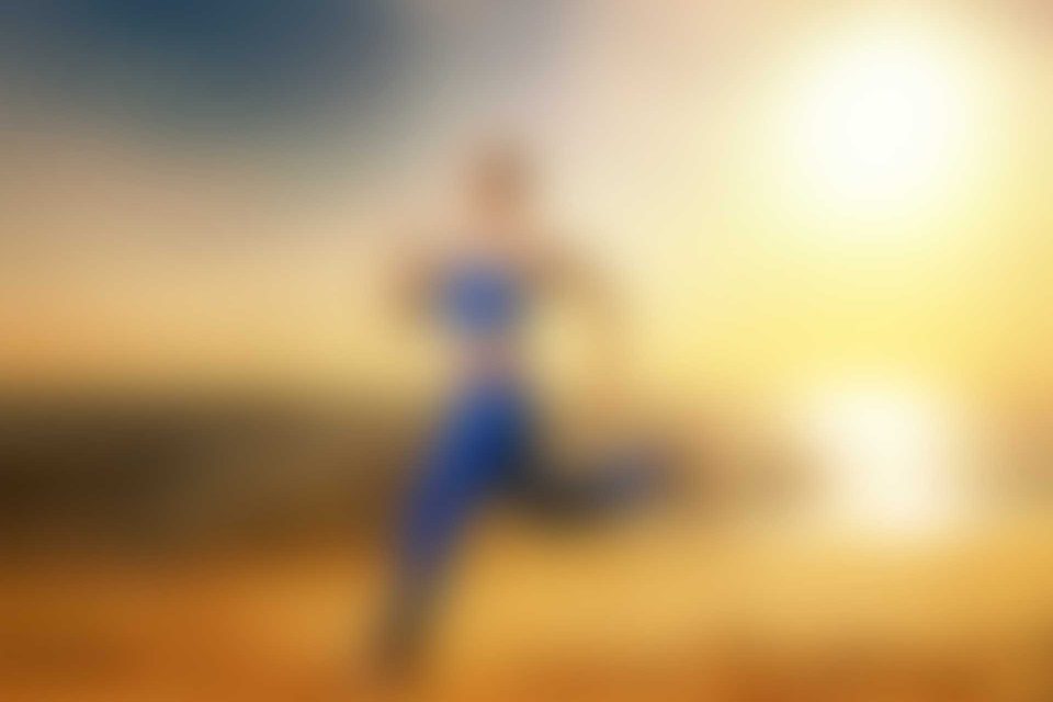 A blurry picture of a person running in the desert